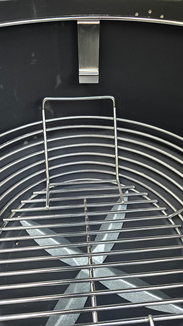 Close-up of Kick Ash Basket handle of the KAB-BKT-C1912 inside the Spider Huntsman Grill.